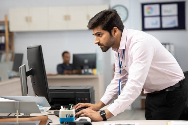 young business person using computer in bank