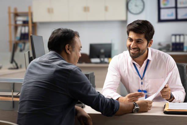 customer with bank manager in office